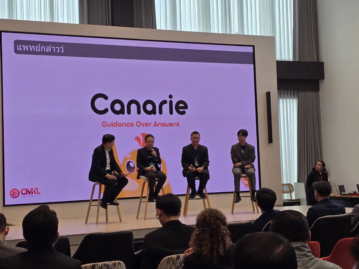 The Canarie "Guidance Over Answers" slide on stage during the panel