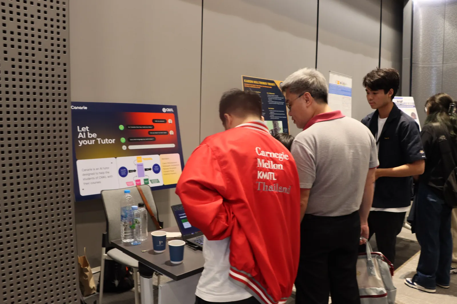 Visitors trying the Canarie demo at our booth